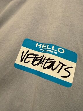 Vetements Light Gray Tee with Blue 'Hello My Name Is' Graphic
